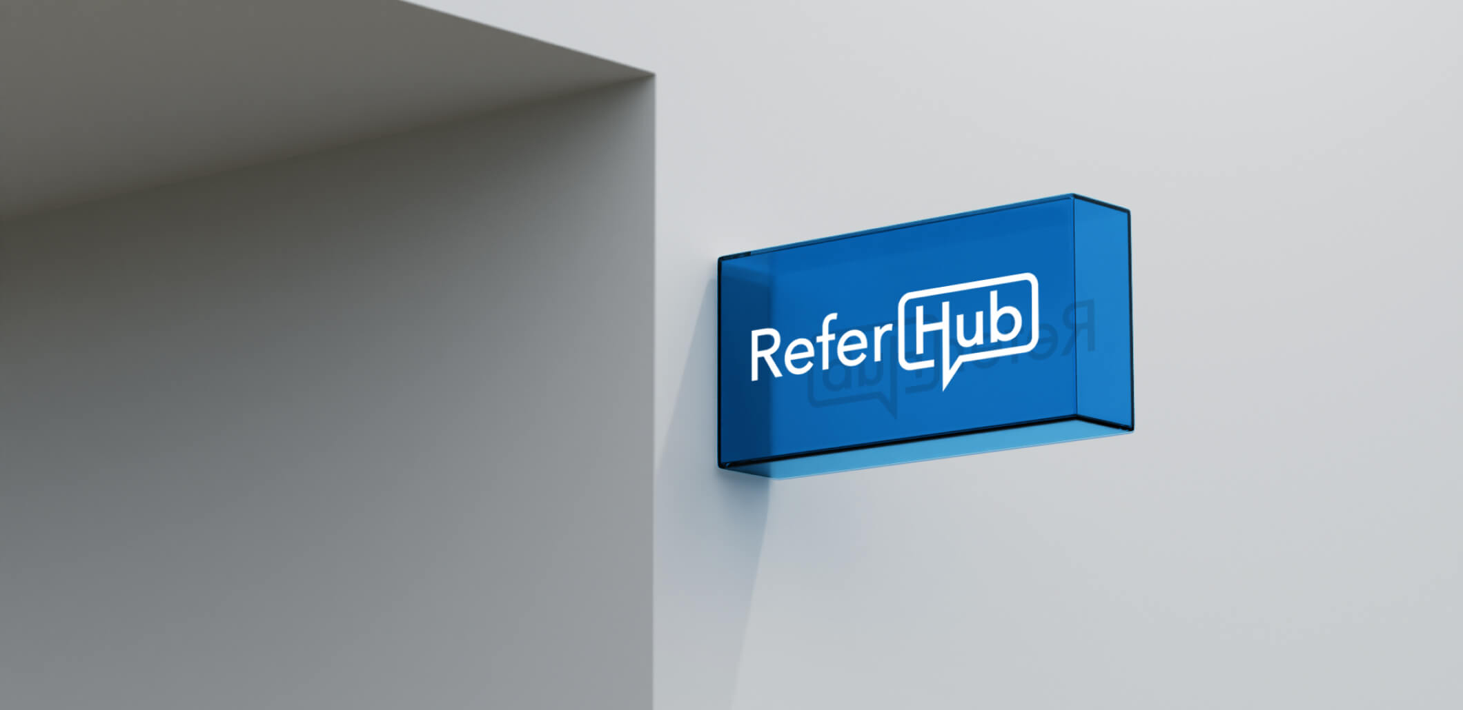ReferHub dashboard on a laptop screen showing referral tracking in white, black, and bright blue.