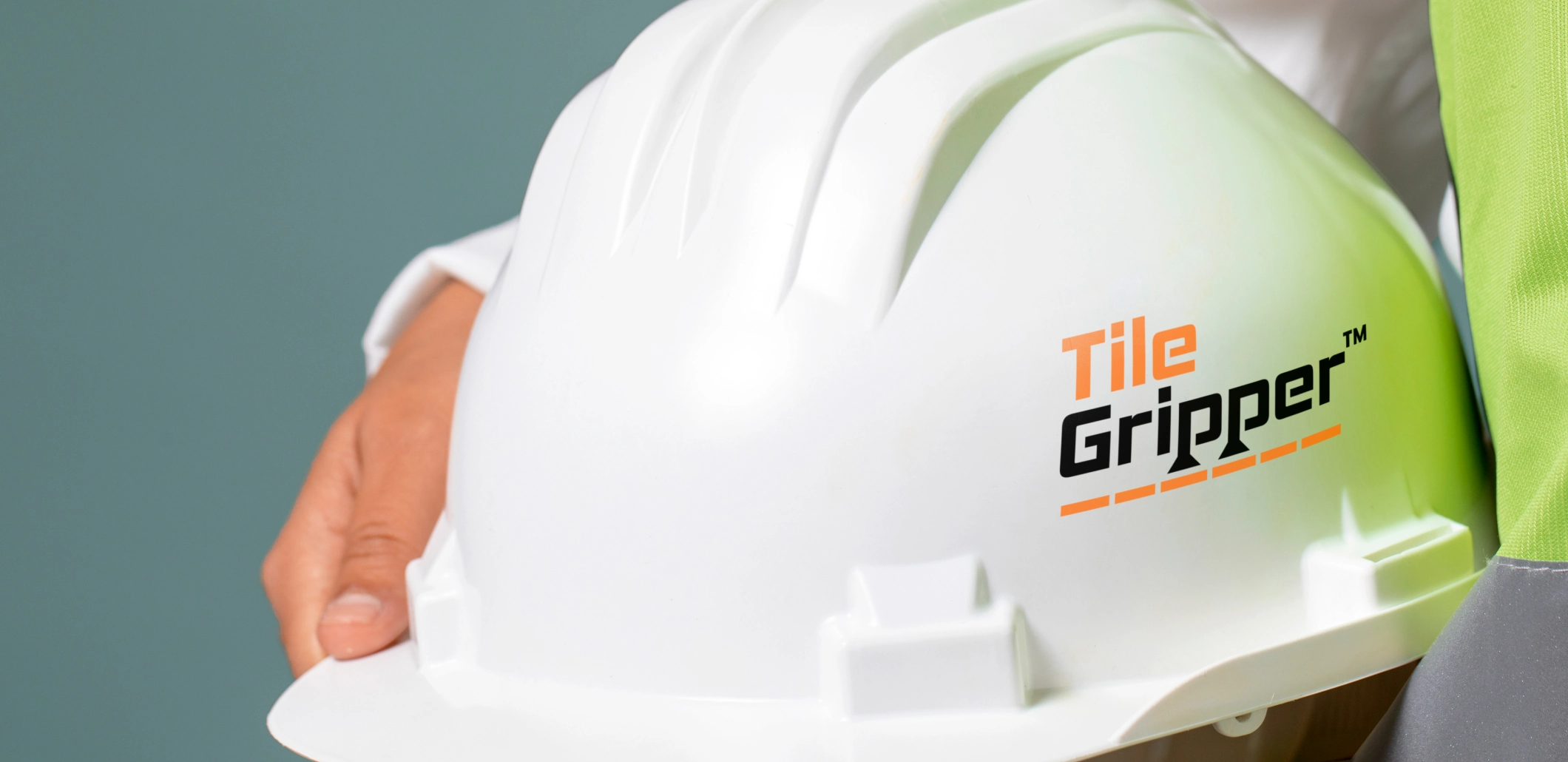 Tile Gripper logo on a white construction helmet.